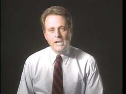 ["In a 1992 campaign ad, Republican candidate Scott Leo Klug addresses the nation from various podiums, earnestly discussing his commitment to significantly reduce government spending and the national deficit. Amidst waving American flags, Klug outlines detailed economic plans aimed at boosting the economy and creating jobs, avoiding partisan attacks and focusing solely on fiscal responsibility."]