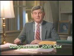 ["The 1992 political TV ad for Democratic Party candidate John W. Cox powerfully portrays the grave economic challenges facing Americans, emphasizing high unemployment and urban decay. Scenes of anxious citizens, closed businesses, and desperate job seekers are shown, while Cox speaks earnestly about his commitment to addressing these issues with effective policy solutions."]