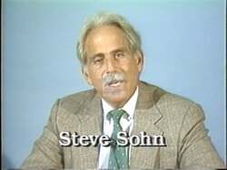 ["In the 1992 political ad, Republican candidate Steve Sohn criticizes Democrat Ed Markey's congressional policies and actions. With earnest expressions and direct appeals, Sohn promises transparency, integrity, and significant change. Throughout the ad, various scenes underscore his commitment to responsible governance, exemplified by his assertive on-camera addresses and a background featuring American flags and campaign slogans."]
