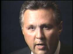 ["In his 1996 political TV ad, Democratic candidate Charlie Jones confidently addresses the nation. Throughout multiple scenes with American flags and campaign posters, Jones showcases his dedication to community and military service. He emphasizes leadership, calls for change, and appeals to a diverse audience, including bilingual outreach, asking emphatically for their votes."]