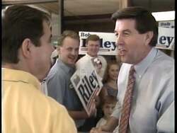 ["Bob Riley's 1996 presidential campaign ad showcases him confidently on his Alabama farm, highlighting his deep local roots and family values. The ad features Riley interacting warmly with supporters and townspeople, underscoring his commitment to community and rural values. Scenes of enthusiastic crowds and serene landscapes reinforce his approachable and steadfast image."]