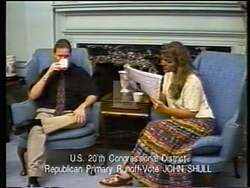 ["In the 1996 congressional campaign ad, Republican John Scholl, alongside his wife Mila, earnestly appeals to voters. Through multiple scenes depicting a united front, the ad emphasizes Scholl's military and family values. The repeated introduction of Mila and consistent appeal for votes aim to personalize and strengthen Scholl's campaign message."]