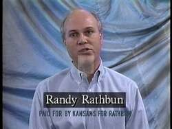 ["In his 1996 presidential campaign ad, Randy Rathbun emphasizes his commitment to safety, fiscal conservatism, and family values. The ad features straightforward appeals made by Rathbun, showcased in professional settings alongside American flags and campaign banners. He earnestly addresses the importance of balanced budgets, community safety, and garnering voter support."]