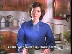 ["In her 1996 campaign ad, Democratic candidate Judy Hancock delivers a heartfelt appeal to Kansas voters, emphasizing her commitment to family-centric policies. Speaking at various events, she focuses on enhancing support for working families and improving community safety. The consistent banner of \"Common Sense, Kansas Values\" underscores her dedication to practical, value-driven governance. In a poignant scene, she discusses policy directly with a working-class family, highlighting her legislative priorities."]