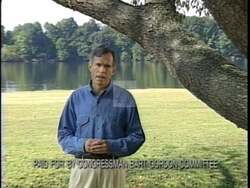 ["In the 1996 presidential campaign ad, Democratic candidate Bart Gordon is filmed at a picturesque lake, where he communicates fervently about his dedication to community and environmental issues. Addressing both the camera and a local audience, he emphasizes his commitment and strong connection with community concerns through a sincere and passionate discourse."]