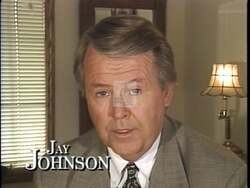 ["In his 1996 campaign ad, Democratic candidate Jay Johnson earnestly denounces negative campaigning, directly addressing the camera with sincerity. He criticizes opponent David Prosser's tactics, presenting himself as a serious, determined candidate focused on positive political communication and clarifying his own stances against a professional backdrop."]