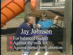 ["In the 1996 political TV ad for Democratic candidate Jay Johnson, scenes likely depict him positively engaging with constituents, emphasizing his approachable and leader-like qualities. Additionally, the ad contrasts his political stance with opponent David Prosser, likely highlighting their differing policies and values, aiming to sway voter opinion in Johnson's favor."]