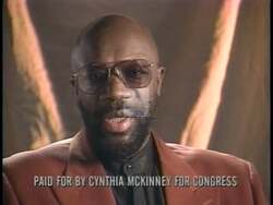 ["In the 1996 political TV ad for Cynthia McKinney's congressional campaign, legendary musician Isaac Hayes endorses McKinney. Throughout the ad, Hayes passionately urges voters to support McKinney, emphasizing the critical importance of casting their votes on the specified date, Tuesday, July 9th. His endorsement is direct and sincere, aiming to rally voter turnout."]