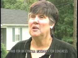["In her 1996 political ad, Democratic Party candidate Cynthia McKinney presents herself as a confident and approachable leader. The ad features scenes of McKinney addressing cheering supporters, engaging with constituents, and highlighted in campaign posters as Georgia's proud congressional representative. The enthusiastic crowd and positive imagery underscore her campaign's key messages and appeal."]