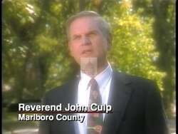 ["In his 1996 campaign ad, John McKee Spratt Jr. positions himself as a determined advocate for controlling TV content to safeguard children. He strongly supports the V-Chip law, aiming to reduce TV violence, repeatedly highlighting his leadership and dedication to family values. His passionate speeches to Congress and at various podiums encapsulate his commitment to enhancing television safety for families."]