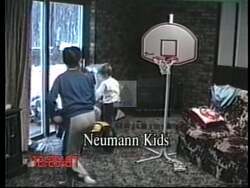 ["In his 1996 presidential campaign ad, Mark Neumann focuses on the future and safety of children, advocating for fiscal responsibility and educational reform. He earnestly addresses voters as a concerned father from various personal settings, including parks and beside an American flag, highlighting family values and hope for a prosperous future."]