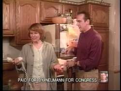 ["The 1996 political TV ad for Republican candidate Mark Neumann focuses on public dissatisfaction with negative campaign tactics. Multiple scenes show individuals and pairs discussing politics, expressing frustration with negative ads from other campaigns. The ad emphasizes a collective decision to support Neumann, seeking a more fact-based, positive political discourse."]