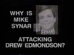["In a 1992 political TV ad, Democratic candidate Drew Edmondson is shown being aggressively confronted by Mike Sinar during a debate. Sinar, appearing defensive and agitated, seeks to deflect attention from his own controversial financial actions and political decisions by focusing his attacks on Edmondson. The ad highlights Sinar's attempts to evade scrutiny of his financial conduct and legislative record."]