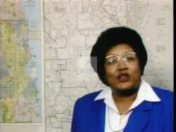 ["In the 1988 campaign ad for Helen Iphegenia Barnhill, scenes showcased enthusiastic rallies with diverse supporters promoting her dedication to education, healthcare, and community service. Barnhill spoke passionately about addressing critical issues, while crowds, including various demographics, rallied with signs, reflecting a widespread community endorsement and promise for change."]