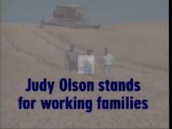 ["In her 1996 presidential campaign ad, Democratic candidate Judy Olson passionately advocates for middle-class families, emphasizing education, healthcare, and economic security. Scenes of Olson addressing diverse, attentive crowds and standing against a backdrop of American flags underscore her commitment to Medicare, Social Security, and robust family policies. The ad portrays Olson as a poised and dedicated leader."]