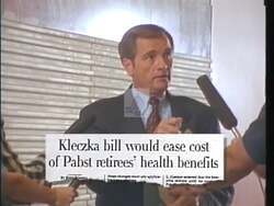 ["The 1996 campaign ad for Jerry Kleczka emphasizes his dedication to workers' rights. Scenes show him speaking to an enthusiastic crowd and in an office setting, passionately advocating for policies to protect retired workers' benefits. Kleczka's focused demeanor underlines his commitment to legislative change and constituency advocacy."]