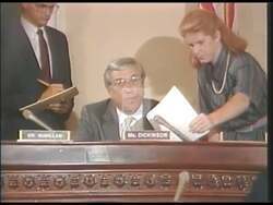 ["In the 1990 campaign ad, Republican Bill Dickinson showcases his dedication to national defense and job creation in Alabama. The ad highlights his leadership roles through various scenes of him speaking to Congress and in meetings, emphasizing his influence in military strategies and economic support during crucial global events."]