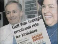 ["In the 1992 political TV ad, Democratic candidate Mike Kreidler speaks at various rally scenes, passionately advocating for health care reform and congressional support. He stands before an engaged audience, with campaign banners emblazoned with his name. His multiple roles as an optometrist, senator, and soldier highlight his diverse capabilities and dedication."]