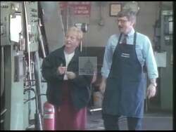 ["In the 1998 presidential campaign ad for Republican candidate Nancy Elizabeth Lee Johnson, scenes depict a defensive Johnson countering opponent Charlotte Koskoff's claims. Johnson highlights her positive job impact and criticizes Koskoff's tax policies, while visuals include concerned workers and voters absorbing the campaign messages, and accusations of dishonesty aimed at Koskoff."]