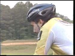 ["In a 1996 political TV ad, Michael Coles, Democratic candidate, showcases his resilience and leadership through engaging imagery of him cycling. The scenes emphasize his achievements as a business founder, commitment to education, and resolve to challenge Newt Gingrich in Congress. His speech, backed by American flags, underscores his dedication to national service and policy advocacy. These visuals metaphorically reflect his journey, portraying him as a determined and capable leader."]