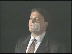 ["In his 1996 presidential campaign ad, Republican candidate Peter I. Blute emphatically calls for enhanced domestic violence legislation. Addressing various audiences, Blute passionately speaks from podiums and directly to the camera, showing a dedicated and hopeful stance on initiating stronger domestic violence laws and securing necessary funding."]