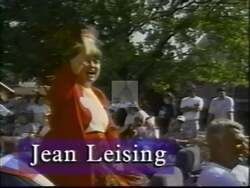 ["The 1998 political TV ad for Republican candidate Jean Leising portrays her as a strong, confident leader. She emphasizes a tough-on-crime stance and supports the death penalty, focusing on family safety and national security. The ad showcases her in various settings, underscored by imagery of the American flag, designed to emphasize her patriotism and leadership qualities."]