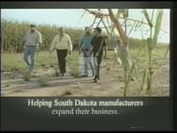 ["In the 2002 political TV ad for Republican candidate Bill Janklow, scenes consistently portray him speaking confidently at various podiums, emphasizing economic growth, job creation, and educational improvements. Janklow is depicted in both public and work settings, engaging with constituents and workers, underlining his leadership and successful policies in South Dakota."]