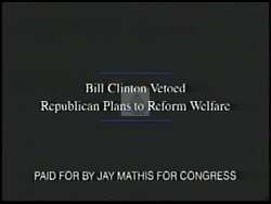 ["In the 1996 presidential campaign ad for Republican Jay Mathis, he passionately condemns the existing welfare system from a podium, surrounded by American flags. He emphasizes the need for robust reform, including strict work requirements and stringent measures to prevent fraud, aiming to address what he views as significant systemic flaws."]