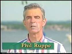 ["The 1992 campaign ad for Phil Ruppe showcases his profound connection to Northern Michigan, emphasizing his dedication to the region���������s beauty and community. Scenes transition from a brewery by a frozen lake, serene wooded landscapes, and community gatherings to personal testimonials. Ruppe passionately speaks about his life���������s dedication, political ambitions, and environmental preservation efforts."]