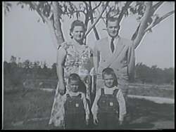 ["In the 1988 campaign ad, Democratic candidate Mike Parker addresses economic challenges and America���������s future with hope and resilience. Various scenes show him speaking confidently at podiums, evoking his humble beginnings and vision at community gatherings. The use of American flags in the background underscores his patriotic message."]