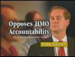 ["In a 2000 political TV ad for Jim Maloney, scenes depict his opponent Mark Nielsen critically. Nielsen appears concerned alongside references to his political decisions and ties to corporate interests, particularly in healthcare. The ad portrays Nielsen negatively with imagery of worried families, healthcare documents, and corporate logos, underscoring controversial policies and questionable campaign donations."]
