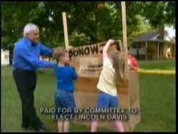 ["In his 2004 campaign ad, Democratic candidate Lincoln Davis emphasizes his commitment to education and traditional values. Scenes depict Davis engaging with diverse, attentive students in various classroom settings, illustrating his advocacy for value-based education. Davis is shown interacting warmly, highlighting his dedication to incorporating traditional values within educational forums."]