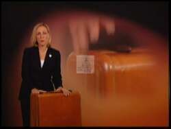 ["In the 2004 TV ad, Democratic Party candidate Charmaine Caccioppi leverages her local appeal as a former Oyster Festival Queen to connect with her district. The recurring visual of her smiling with a suitcase symbolizes her commitment to carrying forward her community's values. Scenes interchange between nostalgic photos, festival banners, and campaign imagery, reinforcing her dedication to both her past achievements and future political goals."]