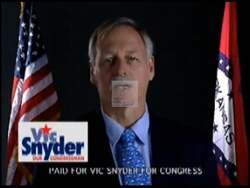 ["In his 2004 campaign ad, Vic Snyder focuses on military support and veterans' care. Featuring scenes of Snyder discussing policies and veterans sharing personal stories, the ad underscores his commitment to essential military equipment and comprehensive veteran welfare. With a background of American flags, Snyder speaks directly to the camera, advocating passionately for U.S. troops and their families."]