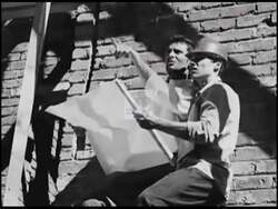 ["The 2006 political TV ad for Democratic Party candidate John Hostettler focuses on the hardships of construction workers impacted by adverse political decisions. It features scenes of weary and worried workers at building sites, symbolizing their frustration and betrayal over unfair overtime policies and lost wages. The ad emphasizes the need for policy change to protect workers' rights and financial security."]