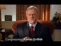 ["In the 2010 presidential campaign ad, Republican candidate Parker Griffith emphasizes his firm opposition to liberal policies and his strong commitment to conservative values. Throughout the ad, Griffith addresses the camera in various formal settings, confidently advocating for conservative principles and seeking support while standing against the liberal agenda, with patriotic backdrops reinforcing his message."]