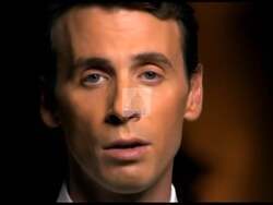 ["In the 2010 political ad, Republican candidate Ben Quayle appears serious and determined, directly addressing the camera with a strong, confident demeanor. He criticizes President Barack Obama's administration, expressing deep concerns about U.S. political leadership and pledging significant changes. His stern criticism suggests a call for drastic political reform."]