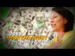["The 2010 political TV ad targets Democratic candidate Martha Roby, focusing heavily on her positions regarding taxes and education funding. Featuring scenes of Roby in various settings, the ad overlays critical text to challenge her fiscal priorities and imply negative consequences for education. The imagery and somber music underscore concerns about her policies on these crucial issues."]