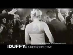 ["In a 2010 Democratic Party political ad targeting Republican candidate Sean Duffy, a series of scenes portray Duffy under spotlights, signing pledges with questionable implications, and awkwardly smiling at rallies. The ad emphasizes the negative impacts of his policies on crime and Social Security, visually contrasting his actions on stage with statistics and criticisms highlighted in background imagery, suggesting a disconnect between his public persona and the outcomes of his tenure. The recurrent symbolic backdrop of closing curtains alludes to a supposed dismal performance in office."]