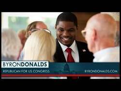 ["In his 2012 campaign ad, Byron Donalds presents himself as a staunch advocate for smaller government and increased personal liberties. Addressing the camera confidently and directly, he underscores his commitment to citizen-driven leadership and governmental reform. The ad, featuring American flags and patriotic symbols, seeks to connect with voters on a personal and nationalistic level, emphasizing grassroots support for his congressional campaign."]