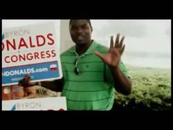 ["In the 2012 campaign ad for Byron Donalds, vivid scenes show dedicated supporters and campaign workers braving a stormy day to mobilize votes. Under torrential rain, they energetically rally, distribute flyers, and board the \"Liberty Express\" bus, showcasing their commitment to promoting Donalds' vision of liberty and leadership despite adverse weather."]
