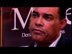 ["In the 2012 political TV ad for Democratic candidate Rudy Moise, various community leaders passionately discuss the socio-economic challenges of a distressed district. They advocate for business-driven solutions, emphasizing the need for economic development and improved healthcare to revitalize the area and uplift its residents."]