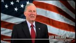 ["In the 2012 political TV ad, Republican candidate Ray Boland passionately emphasizes his military service and commitment to fiscal responsibility. Throughout various scenes, Boland is depicted speaking fervently at podiums, often flanked by American flags, to inspire a sense of patriotism and duty among viewers, urging for national fiscal reform."]
